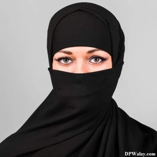 a woman wearing a black hina-4pHy