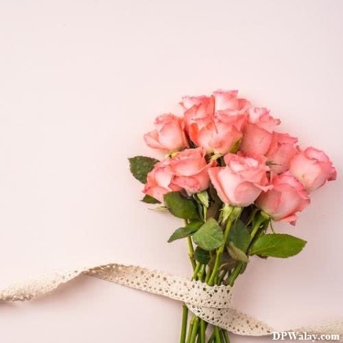 a bouquet of pink roses tied with a white ribbon rose images for whatsapp dp 
