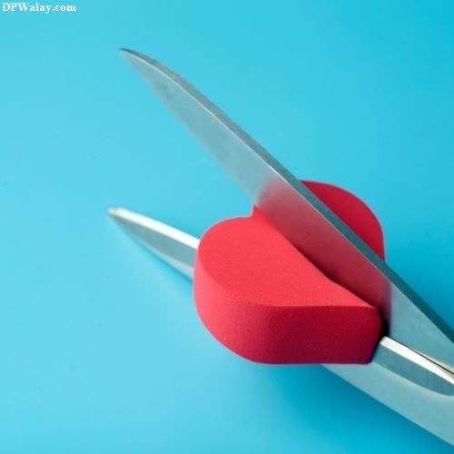 a pair of scissors with a heart on it sad broken dp