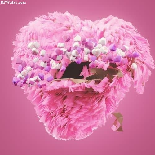 a pink heart shaped flower arrangement sad broken heart dp