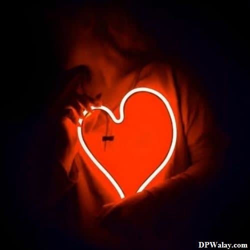 a heart shaped light in the dark