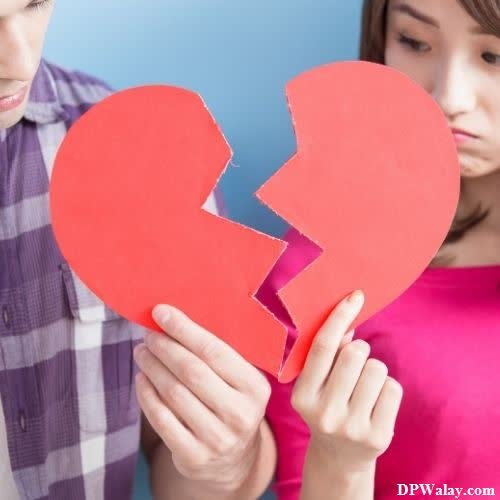 a young boy and girl holding up a broken heart sad heart dp 