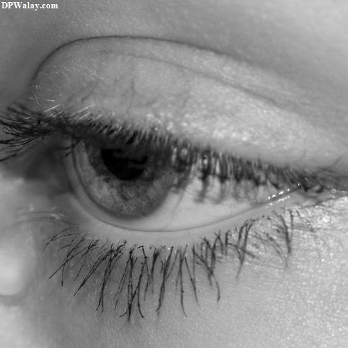 a woman's eye with long eyelashes sad instagram dp 