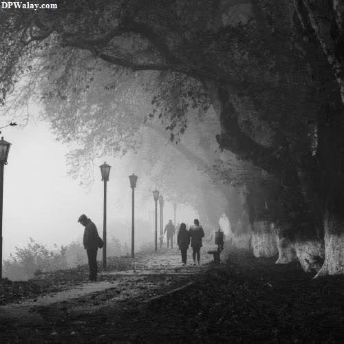 a man walking down a path in the fog sad instagram dp