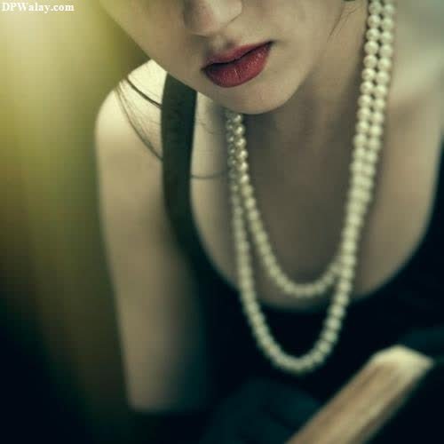 a woman with a pearl necklace and pearls