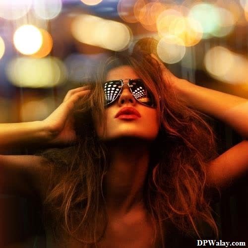 a woman with sunglasses on her face-xFAA images by DPwalay