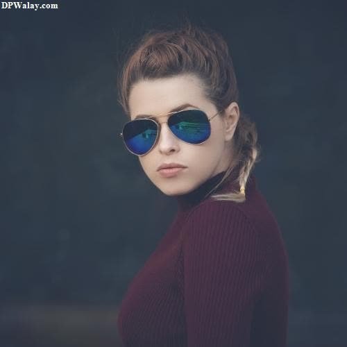 a woman wearing sunglasses with a quote on it images by DPwalay