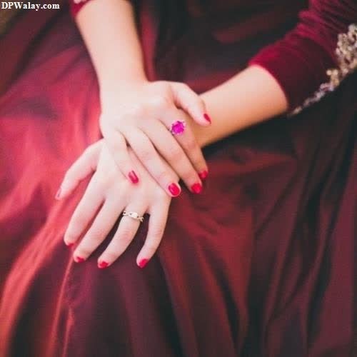 a woman in a red dress with a red mani images by DPwalay