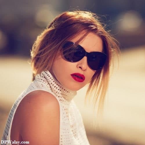 a woman wearing sunglasses and a white top-ybUA single pic for dp 