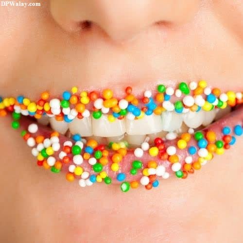 a woman with colorful candy on her mouth 