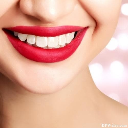 a woman with red lipstick and white teeth