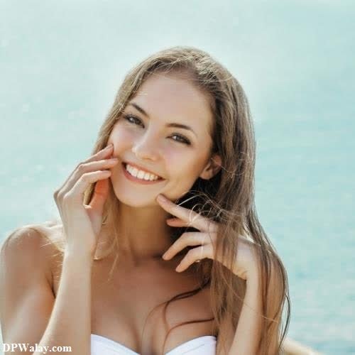 a woman in a white bikini posing for a photo unik dp 