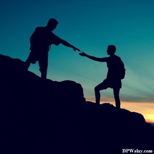 unique dp for whatsapp - two people on top of a mountain holding hands