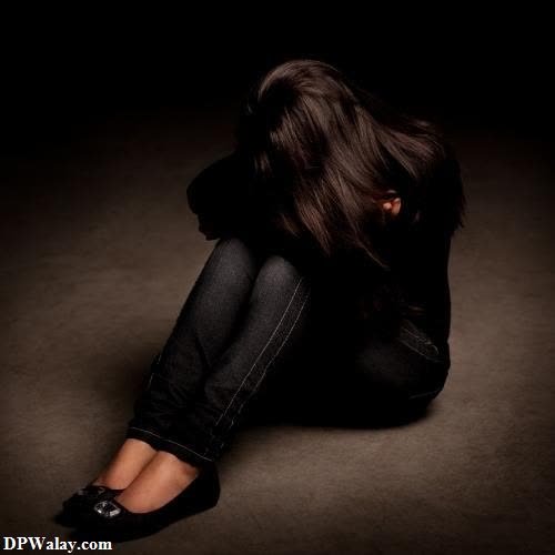 a woman sitting on the floor with her head down very sad dp girl 