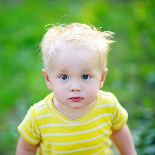 a little boy with blue eyes and blonde hair