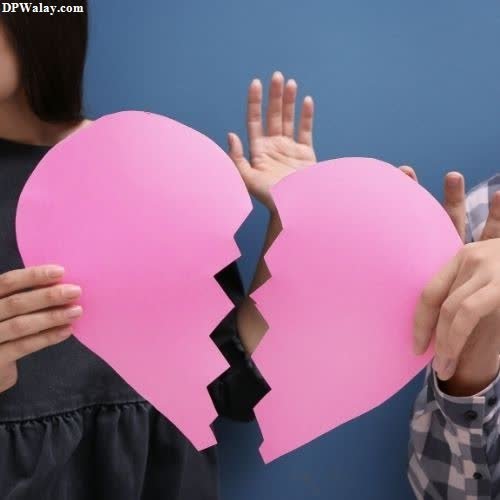 broken dp for whatsapp - two people holding pink paper hearts
