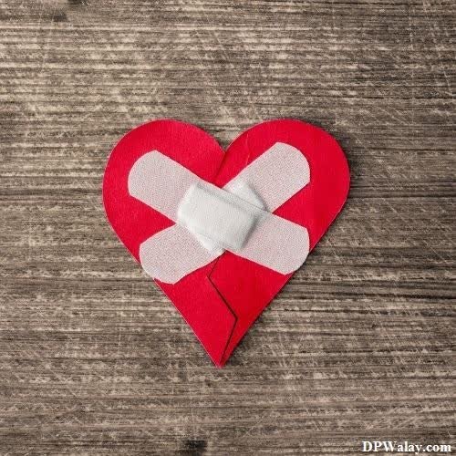 a broken heart with bandages on it images by DPwalay