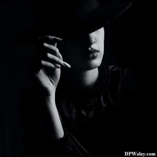 a woman in a hat smoking a cigarette whatsapp dp hot