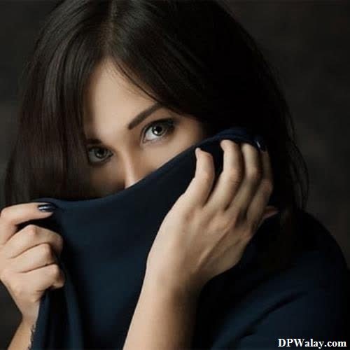 a woman is covering her face with a handkerchief images by DPwalay
