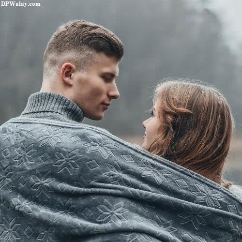 a man and woman wrapped up in a blanket whatsapp wallpaper love 