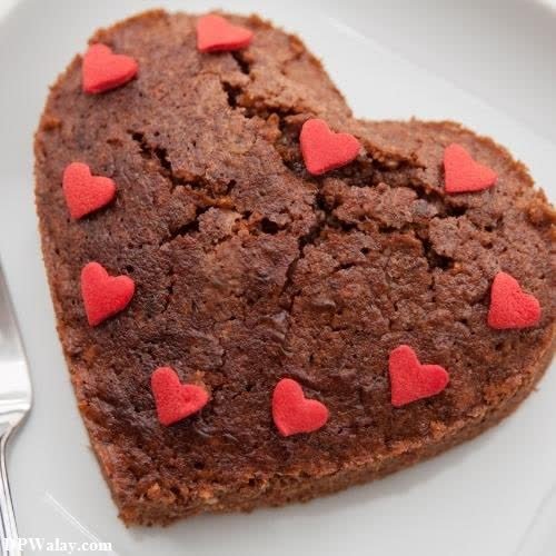 a heart shaped brownie on a plate with a fork images by DPwalay