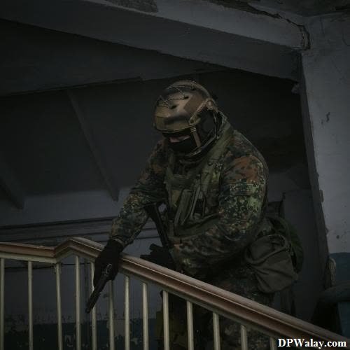 a soldier in a gas mask walks down a flight of stairs