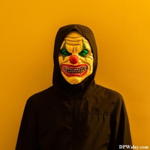 a person wearing a clown mask on their face 