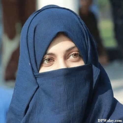 a woman wearing a blue scarf and head scarf images by DPwalay
