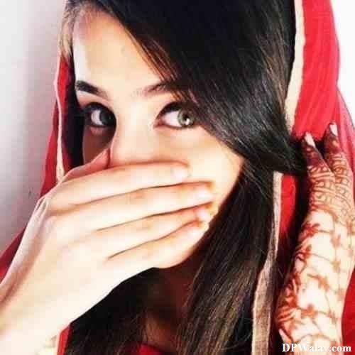 Hijab Girl DP - a woman in a red scarf covering her face