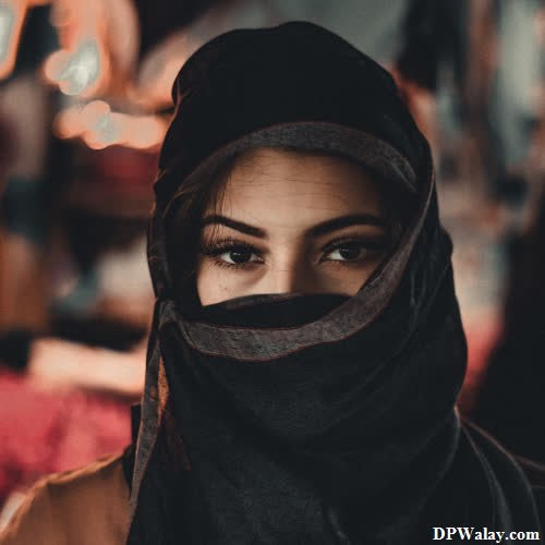 Hijab Girl DP - a woman wearing a black scarf