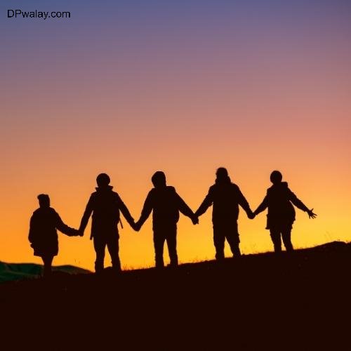 Friends WhatsApp DP - a family holding hands at sunset