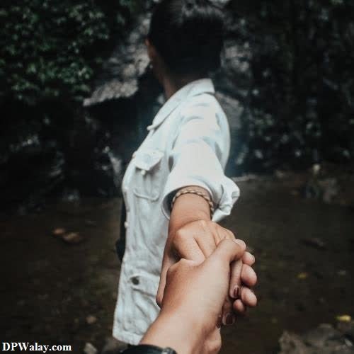Modern Cute Couple DP - a person holding the hand of another person