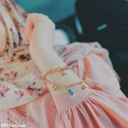a woman wearing a pink dress and a gold bracelet cute hijab girl dp 