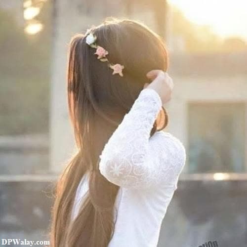 a girl with long hair and a white shirt
