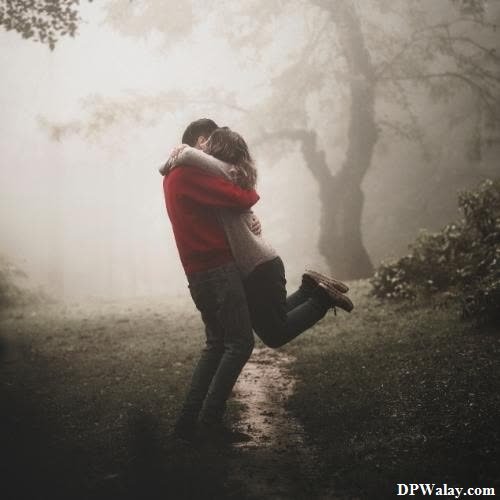 a woman in a red jacket is standing in the fog dp romantic