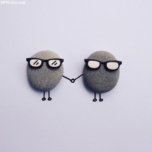 two rocks with glasses on them