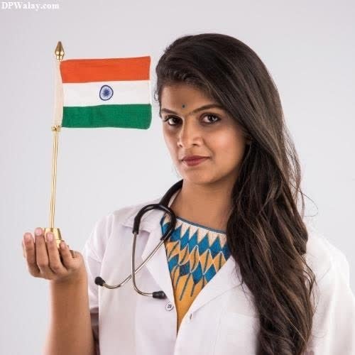 a woman in a white coat holding a flag indian flag whatsapp dp