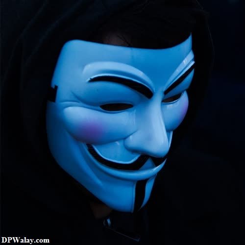 a guy in a mask with a blue light