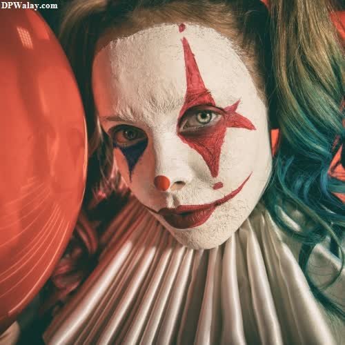 a woman with a clown mask on her face