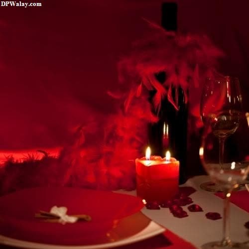 a table set for a dinner with red lighting love dp couple 