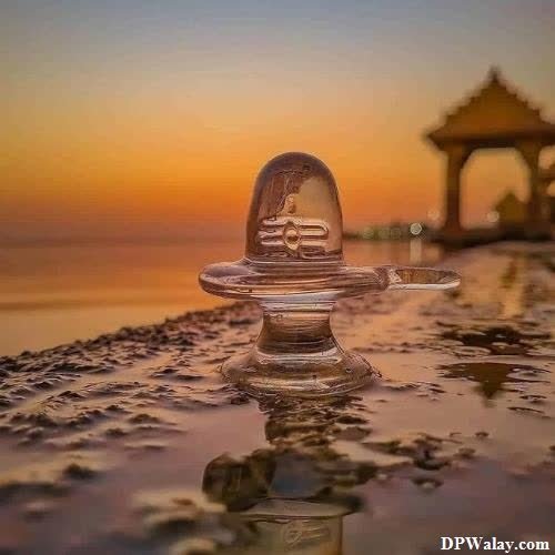 Mahakal DP - a glass ball on the beach at sunset