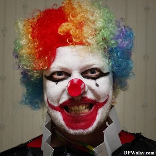 a man with a clown mask on his face