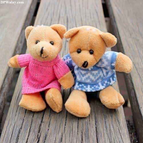 two teddy bears sitting on a wooden bench images by DPwalay