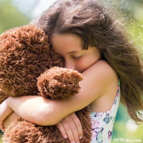 a little girl hugging her teddy bear pink teddy bear dp