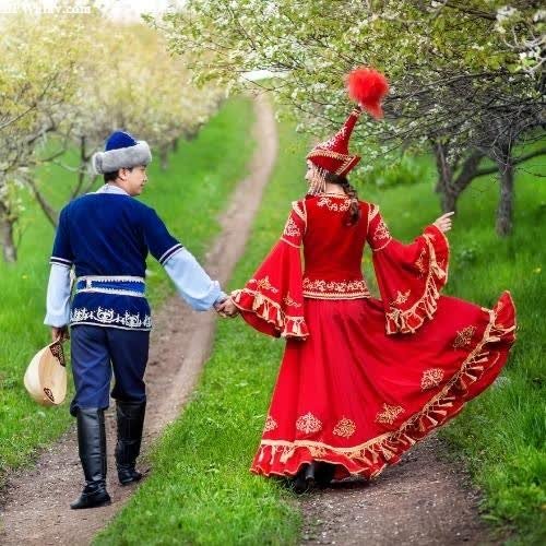 a couple dressed in traditional costumes walking down a path images by DPwalay