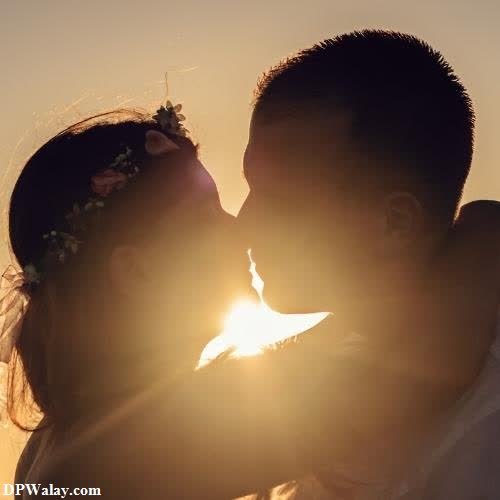 a couple kissing in the sunset-QGfH