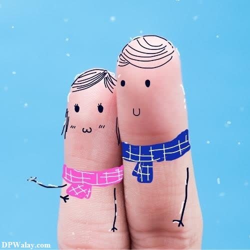 a couple holding hands in the snow