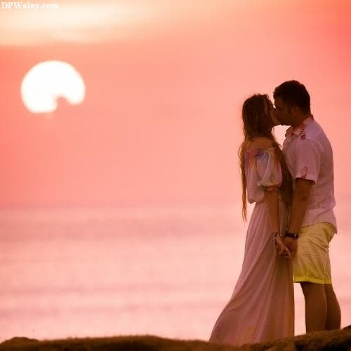 Romantic DP - a couple kissing on the beach at sunset-uwnb