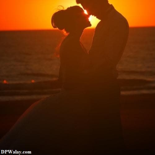 a silhouette of a couple kissing at sunset-ppsH 