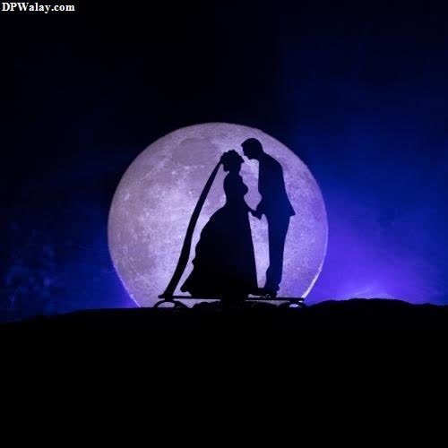 Romantic DP - a silhouetted man and woman in front of a full moon
